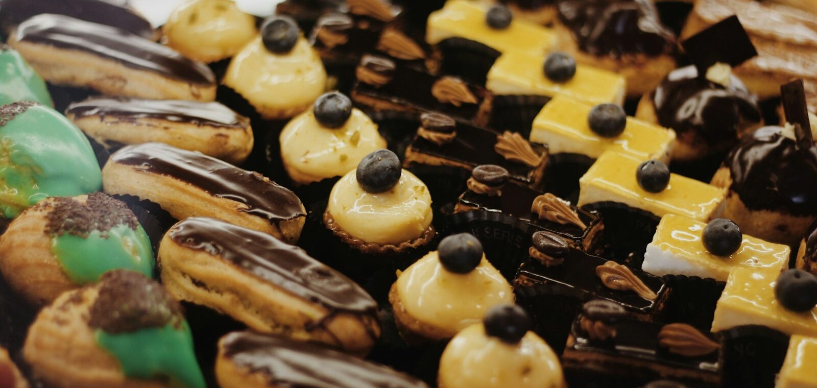 a close up of a tray of cookies and pastries