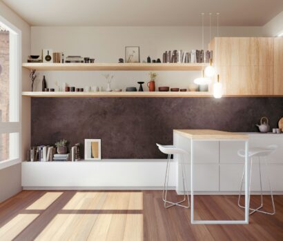 a kitchen with a counter, shelves, and a bar