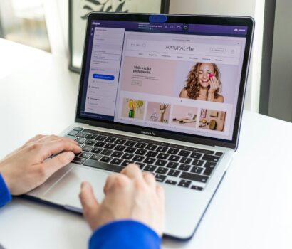 a person using a laptop computer on a table