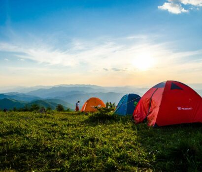 Photo of Pitched Dome Tents Overlooking Mountain Ranges