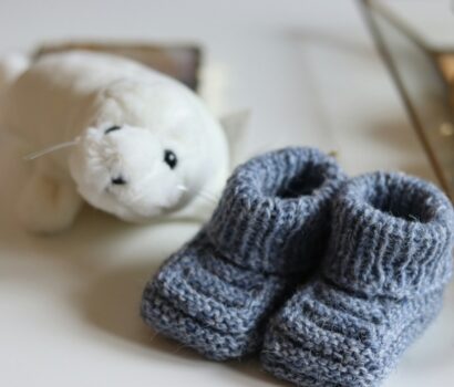 white bear plush toy on white table