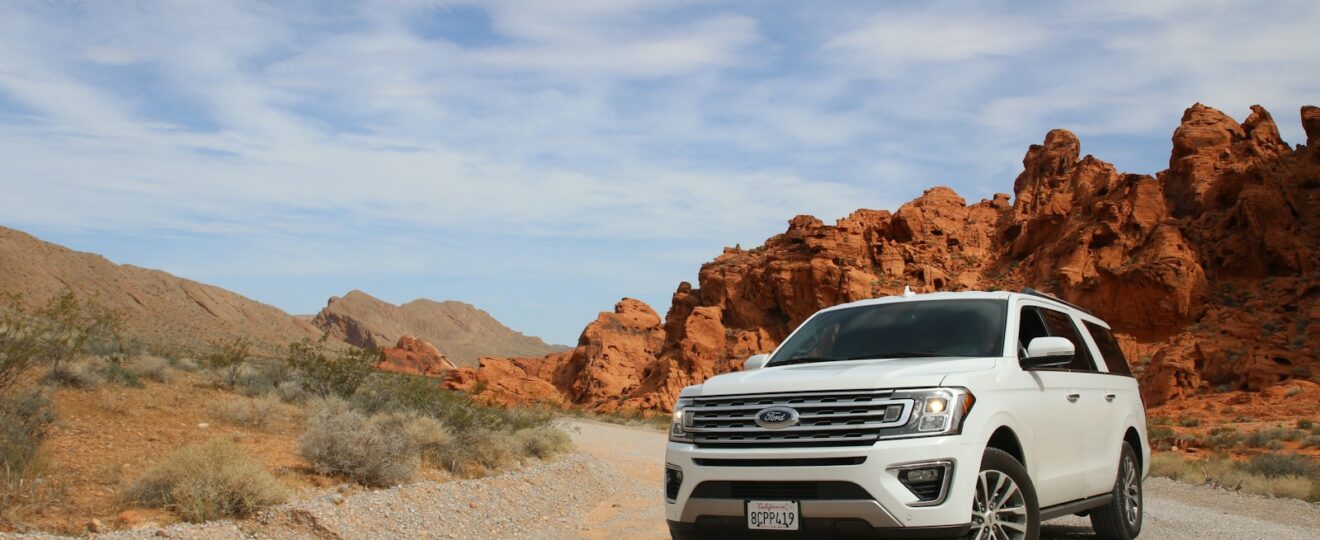 parked white Ford Explorer SUV