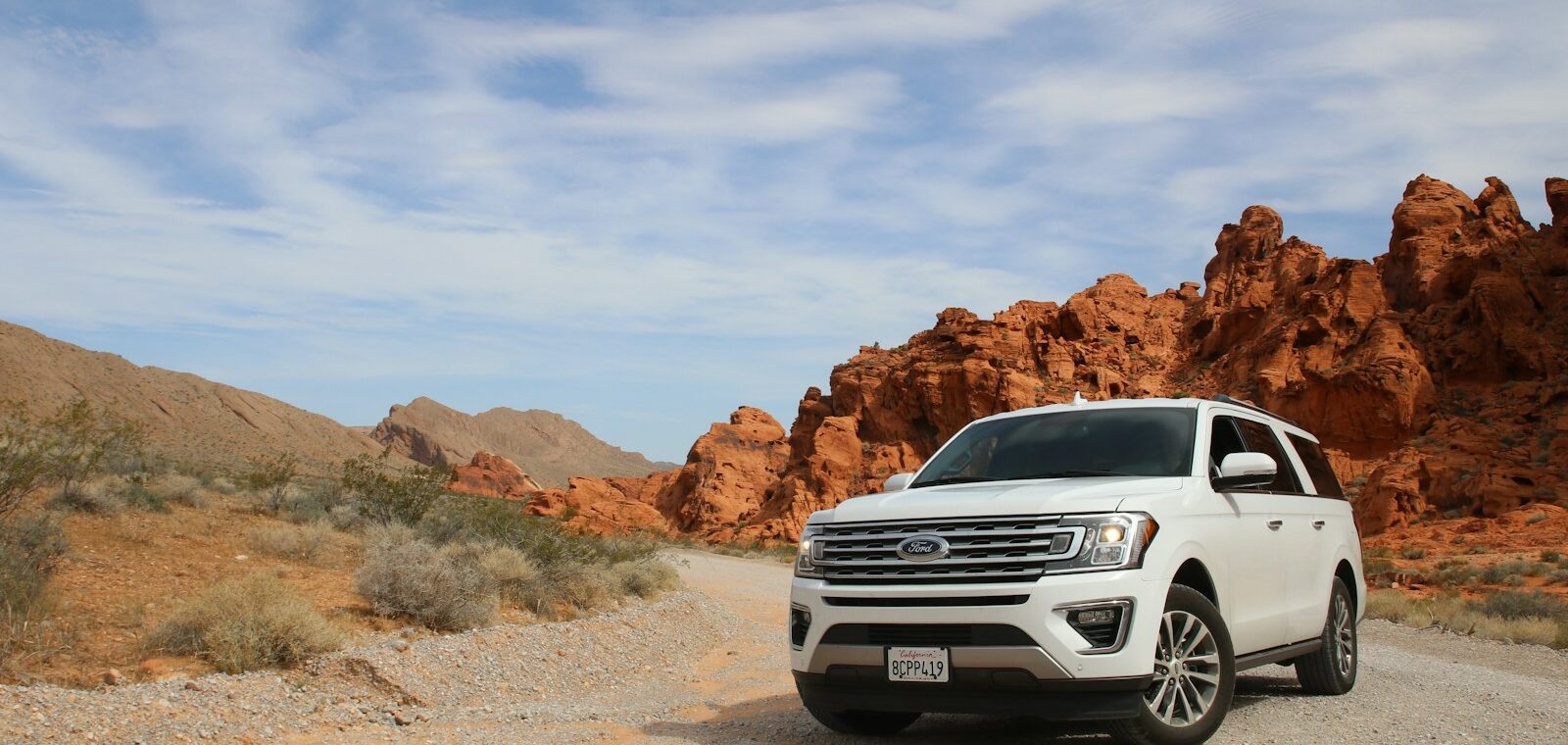 parked white Ford Explorer SUV