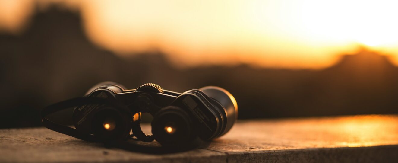 close-up selective focus photo of black binoculars