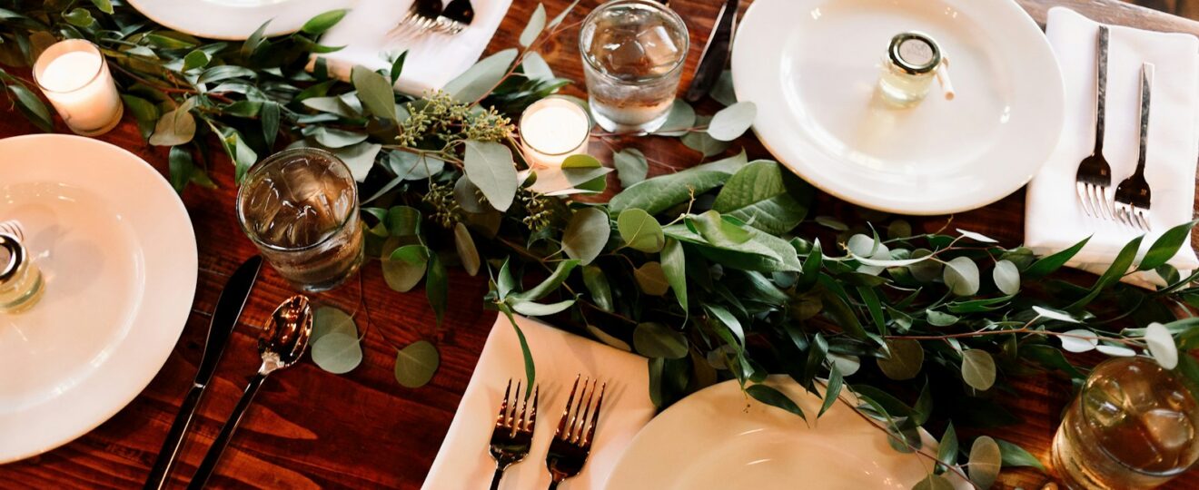 white ceramic dinner plate set on brown wooden table