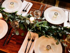 white ceramic dinner plate set on brown wooden table